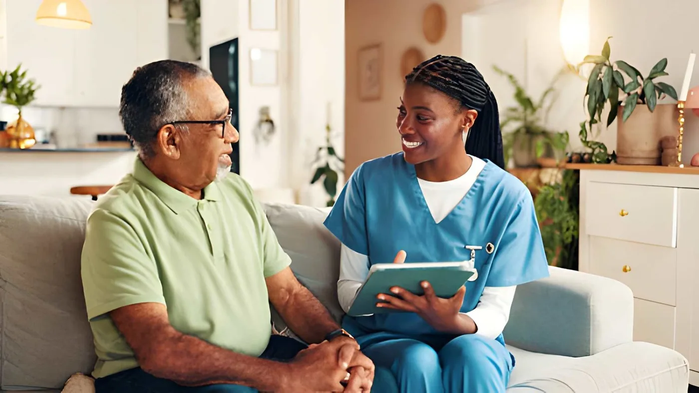 A care professional and older adult discussing a plan together at home